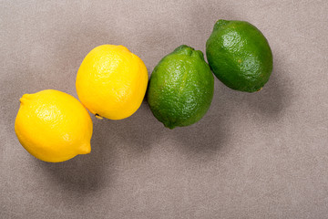 Yellow lemon and lime on table. Top view