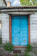 Fototapeta na wymiar An Aged weathered blue door