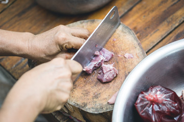 Cutting meat on plate