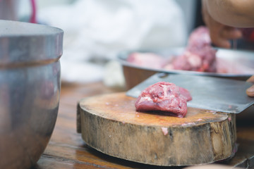 Cutting meat on plate