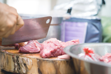 Cutting meat on plate