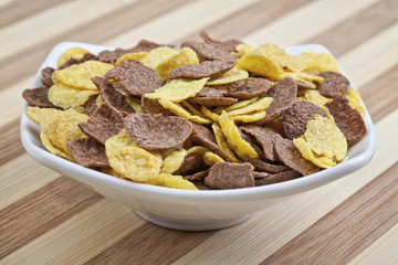Corn flakes on a wooden table