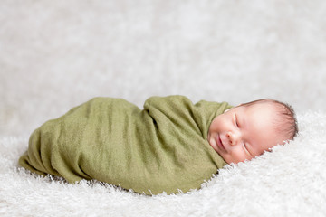 Beautiful newborn wrapped in a blanket
