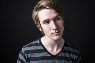 teenager portrait isolated on black background