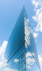 Obraz na płótnie Canvas modern glass building in düsseldorf in Germany skyscraper blue sky editorial