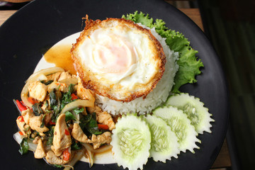 Fried pork basil and egg with rice thai food