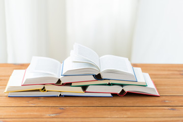 close up of books on wooden table