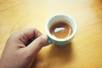 Selfie of hand with espresso coffee