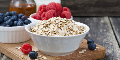 fresh breakfast products on a dark wooden background
