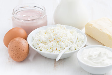 fresh dairy products on white wooden table, closeup