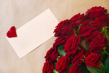 Open empty postal envelope and bouquet of roses