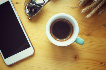Smart phone with coffee cup and sunglass