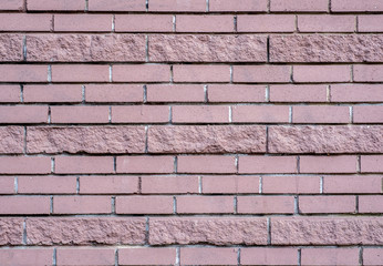 background of dark pink brick laid horizontally