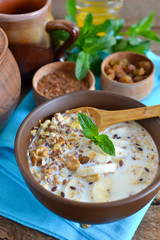 Granola with milk, walnuts and a banana for breakfast