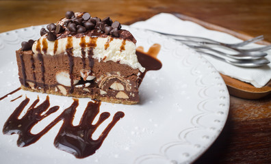 Sweet chocolate ship cake with syrup on the dish