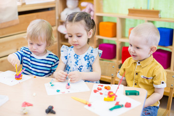 kids learning arts and crafts in kindergarten