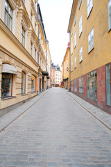 Fototapeta na wymiar Stockholm, Sweden - March, 16, 2016: landscape with the image of Old Town street in Stockholm, Sweden