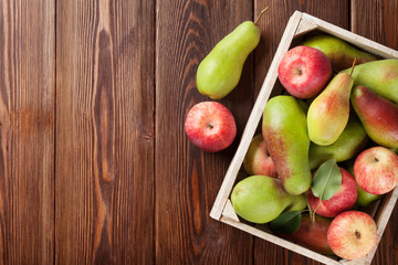 Pears and apples in wooden box on table © Evgeny Karandaev