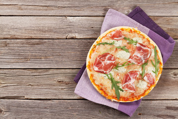 Pizza with prosciutto and mozzarella
