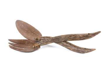 Spoon and fork made from coconut shell on white background