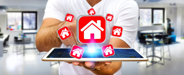 Businessman using modern mobile phone to rent a flat
