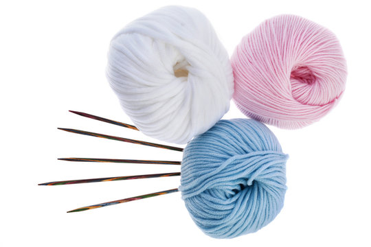 Pastel yarn hanks with set of wooden knitting needles