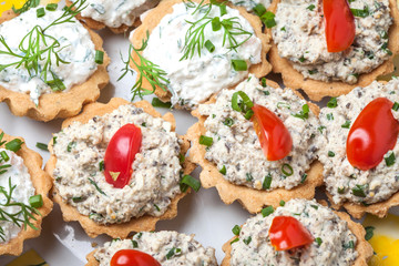 Muffins with smoked salmon pate, cheese and dill.