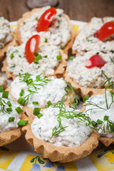 Muffins with smoked salmon pate, cheese and dill.