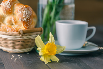 Spring breakfast with pastry and spring flowers