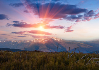 View of colorful sunset in the spring mountains.