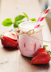Strawberry smoothie in glass jar