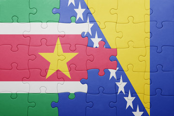 puzzle with the national flag of bosnia and herzegovina and suriname