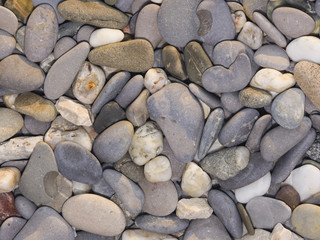 Abstract pebble stones background texture macro, selective focus
