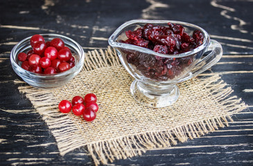 fresh cranberries and dried on a wooden  table
