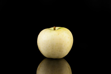 Summer green apples on a black background