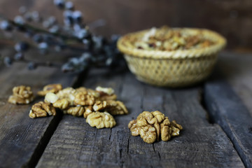 Fototapeta na wymiar peeled walnut on a wooden background