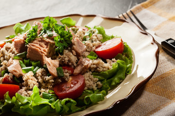 Tasty salad with couscous, tuna and vegetables