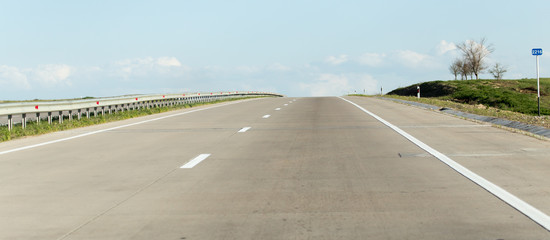 Naklejka premium new asphalt road on nature