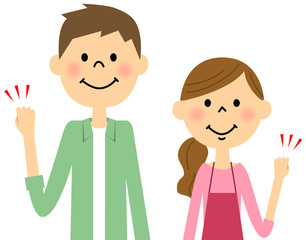 ガッツポーズをする若いカップル　 