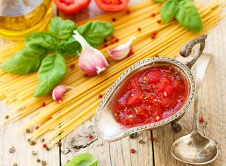 Homemade tomato sauce for pasta and meat from fresh tomatoes with garlic, Basil and spices. Selective focus
