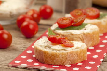 Fototapeta na wymiar tasty bread slices with butter spread and tomato slices