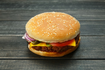 Meet and cheese burger at rustic wood