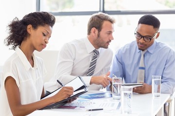 Business colleagues discussing a report