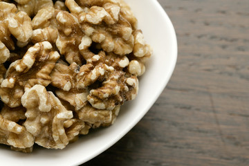 a bowl of peeled walnuts