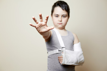 cute boy with broken arm
