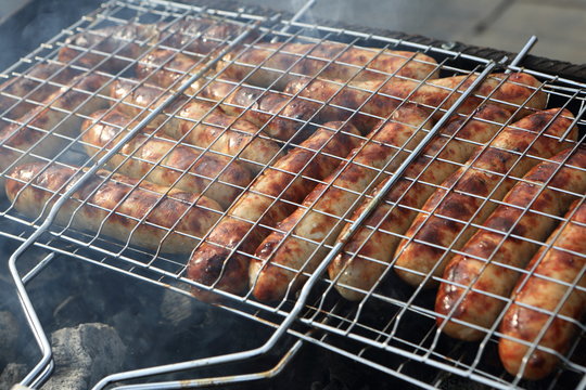 Cooking of sausages on the grill