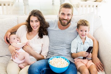 Family having fun while watching television