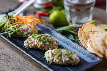 Fish tartare with herbs and carrot