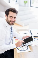 Obraz na płótnie Canvas Businessman using digital tablet