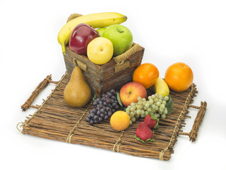 Obraz na płótnie Canvas tasty summer fruits in backet isolated on white